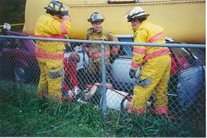 Firefighter prepare to move the victim to the transport site